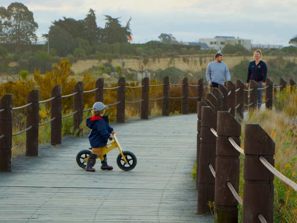 Family on the boardwalk in Caroline Bay, Timaru, New Zealand Freewalks.nz