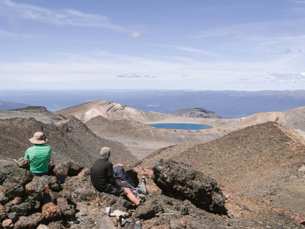 Taking in the view of Emerald Lake on the Tongariro Northern Circuit - walk by Olly from Freewalks - National Park