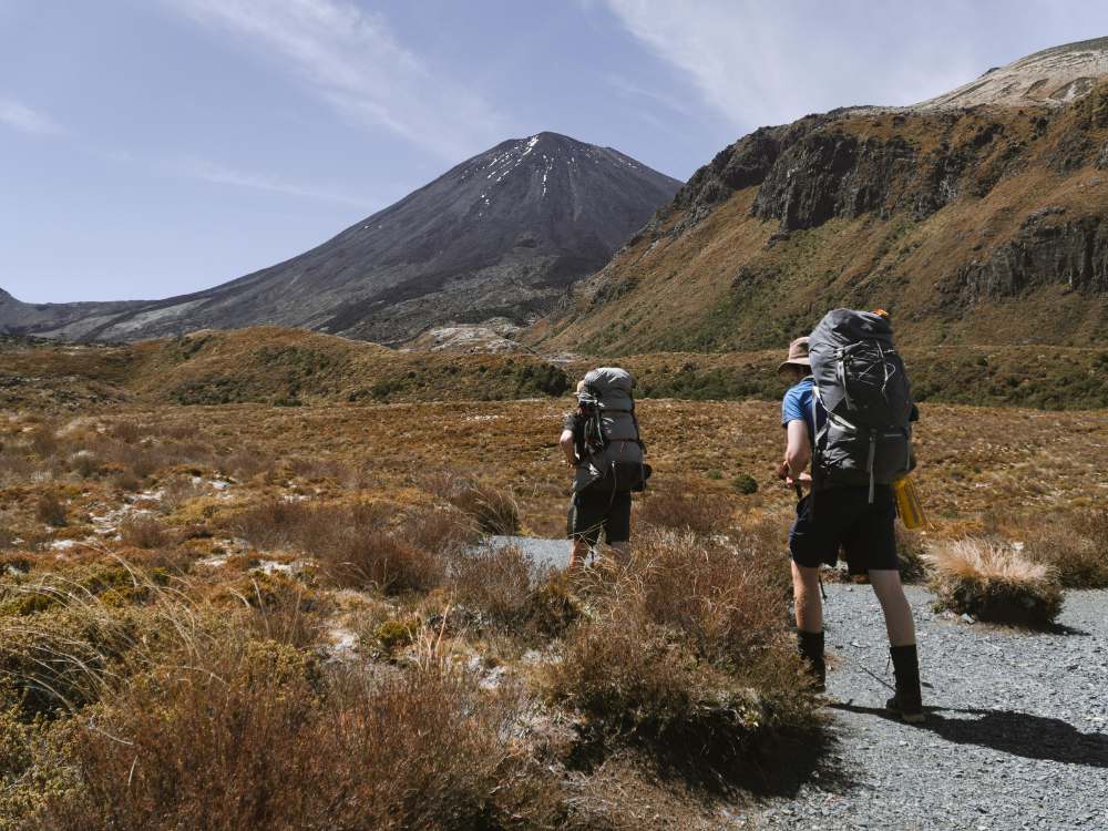 Walking through the Mangatepopo Valley is a humbling experience. Mt Ngauruhoe dwarfs hikers on the Tongariro Northern Circuit - walk by Olly from Freewalks - National Park