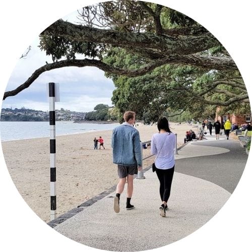Couple walking along the waterfront in Auckland
